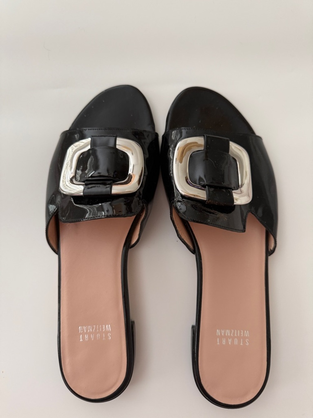 Stuart Weitzman Black Patent Slide Mules with Silver Buckle